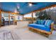 Charming screened-in porch offering cozy seating and a glimpse of the backyard landscape beyond at 5529 Golden Rice Ln, Ravenel, SC 29470
