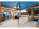 Well-equipped screened-in porch with a bar, lounge area, and access to a hot tub for ultimate relaxation at 5529 Golden Rice Ln, Ravenel, SC 29470