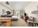 Comfortable bedroom features a king bed, work space, balcony access and neutral decor at 5804 Palmetto Dr # A-208, Isle of Palms, SC 29451