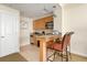 Galley kitchen boasts granite countertops, stainless appliances, and barstool seating at 5804 Palmetto Dr # A-208, Isle of Palms, SC 29451