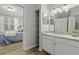 Bathroom with a white marble countertop vanity with an open doorway view into the bedroom at 60 Fenwick Hall Allee # 728, Johns Island, SC 29455