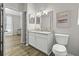 Well-lit bathroom with a marble vanity, modern lighting, and a convenient layout at 60 Fenwick Hall Allee # 728, Johns Island, SC 29455