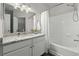 Bright bathroom featuring a marble countertop, white cabinetry, and a shower-over-tub combination at 60 Fenwick Hall Allee # 728, Johns Island, SC 29455