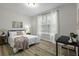 Serene bedroom with a cozy bed, natural light, and a dedicated workspace at 60 Fenwick Hall Allee # 728, Johns Island, SC 29455