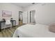 Comfortable bedroom with a minimalist design, desk, and access to en-suite bathroom at 60 Fenwick Hall Allee # 728, Johns Island, SC 29455