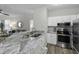 Open kitchen with granite counters and stainless steel appliances at 60 Fenwick Hall Allee # 728, Johns Island, SC 29455