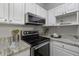 Kitchen with stainless steel appliances and white cabinets at 60 Fenwick Hall Allee # 728, Johns Island, SC 29455