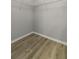 Walk-in closet with vinyl wood-style flooring and installed wire rack shelving at 60 Fenwick Hall Allee # 728, Johns Island, SC 29455
