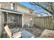 Cozy backyard featuring a screened-in porch, patio area, and blooming tree at 6244 Lucille Dr # B, North Charleston, SC 29406