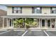 Inviting townhome with covered entry, parking, and decorative palms at 6244 Lucille Dr # B, North Charleston, SC 29406