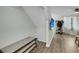 Entryway with hardwood floors, mounted TV, and shoe rack at 6244 Lucille Dr # B, North Charleston, SC 29406