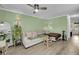 Inviting living area with hardwood floors, stylish sofa, and contemporary decor at 6244 Lucille Dr # B, North Charleston, SC 29406