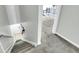 Carpeted stairs lead to a bedroom and hallway, offering a glimpse into the living space upstairs at 6244 Lucille Dr # B, North Charleston, SC 29406