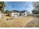 Large backyard featuring a patio, garden bed, and well-maintained lawn at 7034 Lanier St, Hanahan, SC 29410