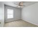 Bright and airy bedroom with a ceiling fan, plush carpeting, and a large window at 7034 Lanier St, Hanahan, SC 29410