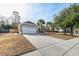 Exterior view of the garage and driveway, showcasing the home's curb appeal at 7034 Lanier St, Hanahan, SC 29410