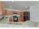 Well-equipped kitchen with stainless steel appliances, sleek countertops, and wood cabinets at 7034 Lanier St, Hanahan, SC 29410