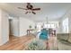 The living room is open to the dining area and features hardwood floors and plenty of seating at 7034 Lanier St, Hanahan, SC 29410