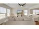 Inviting living room with a modern ceiling fan and large windows at 7034 Lanier St, Hanahan, SC 29410