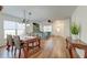 Open-concept living and dining area with hardwood floors, perfect for entertaining at 7034 Lanier St, Hanahan, SC 29410