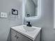 Stylish bathroom sink and a modern illuminated mirror, creating a sleek design at 7461 Church Hill Rd, Hollywood, SC 29449