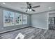 Comfortable bedroom with three windows providing natural light and views of the outdoors at 7461 Church Hill Rd, Hollywood, SC 29449