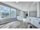 Bright dining area with white cabinets, granite countertops, and hardwood floors at 7461 Church Hill Rd, Hollywood, SC 29449