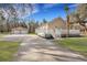 Exterior view of home, garage, and back deck with a long driveway at 7461 Church Hill Rd, Hollywood, SC 29449