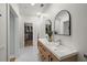 Bright bathroom features double sinks, modern fixtures, and ample counter space leading to a walk-in closet at 801 Balgrove Ct # 801, Mount Pleasant, SC 29466