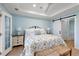 Inviting bedroom features a floral bedspread, hardwood floors and sliding door to additional room at 801 Balgrove Ct # 801, Mount Pleasant, SC 29466