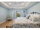Cozy bedroom with a floral bedspread, hardwood floors and balcony access for natural light and fresh air at 801 Balgrove Ct # 801, Mount Pleasant, SC 29466