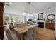 Dining area features hardwood floors, a fireplace, and natural light from the surrounding windows at 801 Balgrove Ct # 801, Mount Pleasant, SC 29466