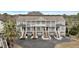 Charming multi-Gathering exterior showing individual entrances, balconies and mature palm tree at 801 Balgrove Ct # 801, Mount Pleasant, SC 29466