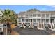 Charming multi-Gathering exterior showing individual entrances, balconies and well-manicured landscaping at 801 Balgrove Ct # 801, Mount Pleasant, SC 29466