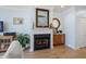 Charming living room features a fireplace, hardwood floors and stylish decor, perfect for relaxation at 801 Balgrove Ct # 801, Mount Pleasant, SC 29466