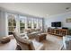 Bright living room with large windows offering a great view, paired with hardwood floors and comfortable furniture at 801 Balgrove Ct # 801, Mount Pleasant, SC 29466