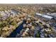 Stunning aerial view of a waterfront property with a private dock and beautiful landscaping at 810 Harbor Place Dr, Charleston, SC 29412
