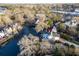 Overhead view of a waterfront home with private dock access and mature tree coverage at 810 Harbor Place Dr, Charleston, SC 29412