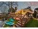 Charming backyard features a tiered deck, hot tub, kayak storage, and waterfront access for outdoor enjoyment at 810 Harbor Place Dr, Charleston, SC 29412