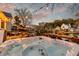 Enjoy outdoor living with a hot tub, string lights, and waterfront views, perfect for entertaining or unwinding at 810 Harbor Place Dr, Charleston, SC 29412