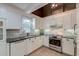 Well-lit kitchen with white cabinetry, granite countertops, and stainless steel appliances at 810 Harbor Place Dr, Charleston, SC 29412
