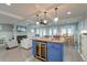 Open-concept living area featuring fireplace, kitchen island, and coffered ceiling at 810 Harbor Place Dr, Charleston, SC 29412