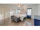Bright main bedroom with hardwood floors, neutral walls, large windows and a seating bench at 810 Harbor Place Dr, Charleston, SC 29412