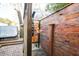 Private outdoor shower with wood paneling and modern fixtures by the hot tub at 810 Harbor Place Dr, Charleston, SC 29412