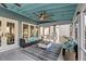 Comfortable screened porch featuring plush seating, a ceiling fan, and an area rug at 810 Harbor Place Dr, Charleston, SC 29412