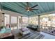 Inviting screened porch with comfortable seating and view of water at 810 Harbor Place Dr, Charleston, SC 29412