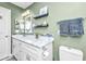 Bright bathroom featuring a white marble vanity, mosaic backsplash, and stylish fixtures at 8120 Shadow Oak Dr, North Charleston, SC 29406