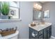 Stylish bathroom features a modern vanity, decorative mirror, and charming decor at 8120 Shadow Oak Dr, North Charleston, SC 29406