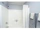 Bathroom with a sleek shower and tub combination and neutral-colored walls at 8120 Shadow Oak Dr, North Charleston, SC 29406