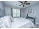 A Primary bedroom with a gray bed and white bedding at 8120 Shadow Oak Dr, North Charleston, SC 29406